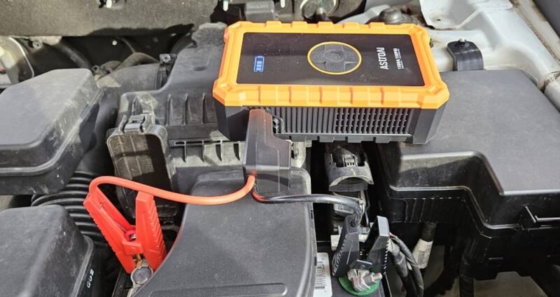 Cables connected to car battery.
