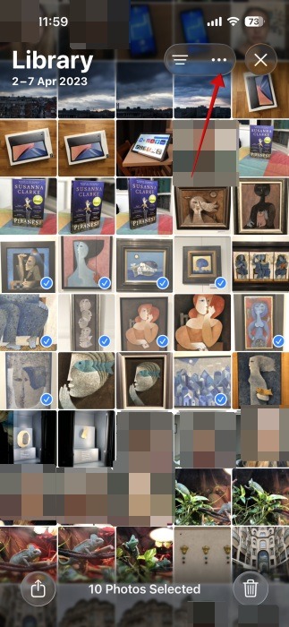 Tapping dot button in Photos app on iPhone. 