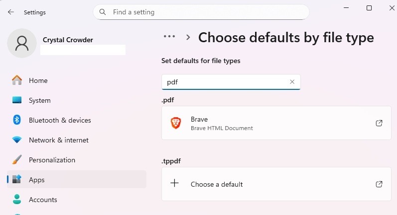 Changing app defaults in Windows settings.