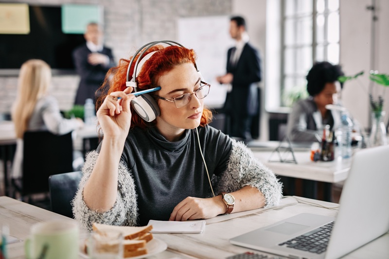 Woman trying to focus at the office. 