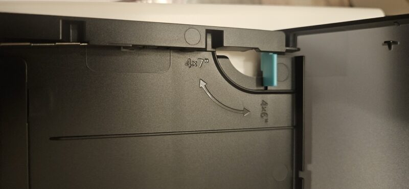 Switch in paper tray to switch between paper sizes.