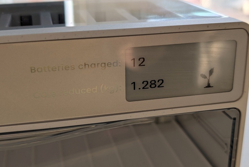 Linogy E-ink display on charging station showing number of batteries charged.