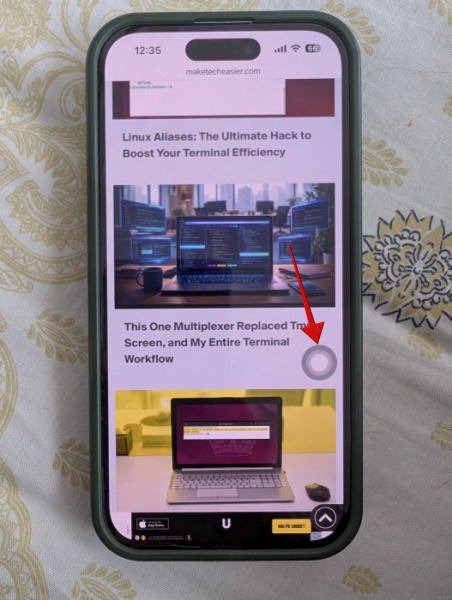 On-screen navigation bar visible on iPhone screen. 