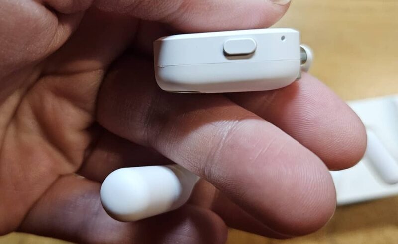 Physical button on OpenRock X earbud.