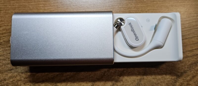 OpenRock X case opened with earbud in it.