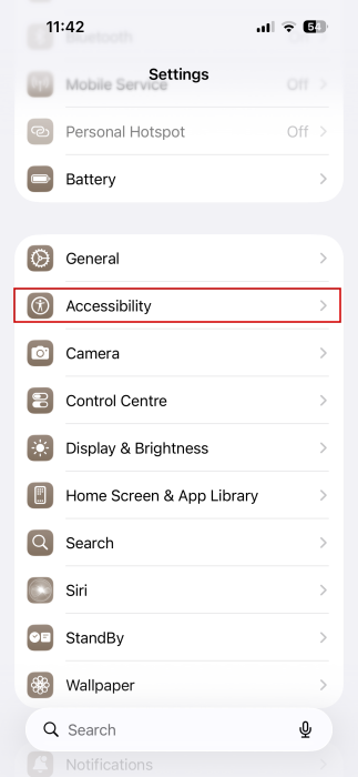 Navigating to "Accessibility" in iPhone Settings. 