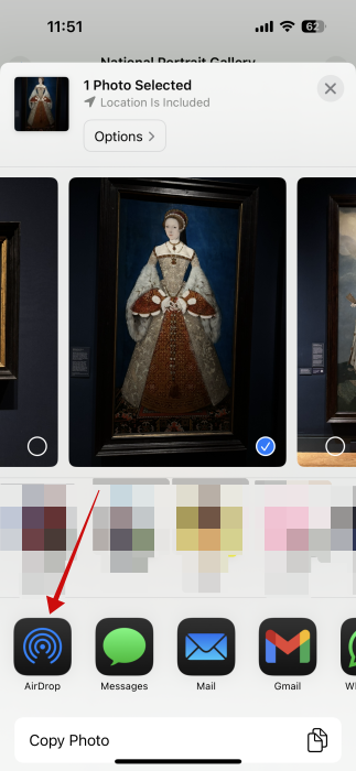 Selecting AirDrop option from Share menu on iPhone. 